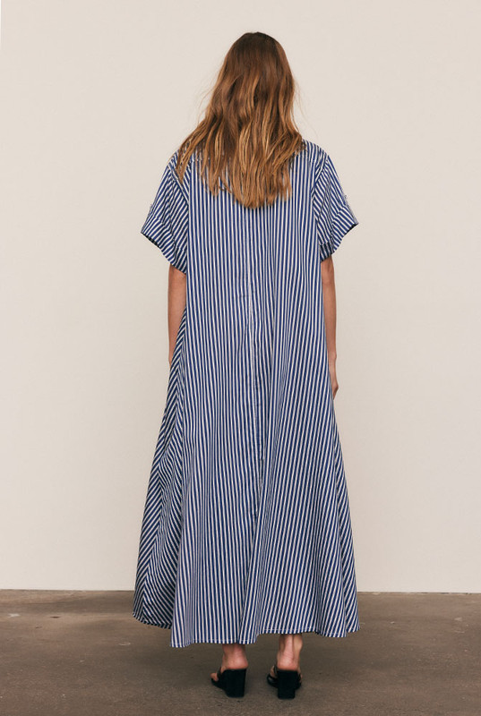 A reinvention of our best-selling Opera Shirt Dress, this new-season update arrives in a soft Rayon–Tencel blend with short sleeves and a camp collar, reimagined for high summer. Refined red Bohemian Traders embroidery adorns the chest, while the fluid stripe fabric and relaxed tailoring offer effortless versatility — the perfect balance of structure and ease.