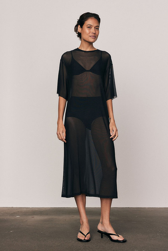 The Mesh T-Shirt Dress in soft, lightweight mesh redefines everyday ease. Cut oversized for fluid drape and comfort, it layers effortlessly over your swimwear or slip dress. Designed for convenience and modern versatility, it's a wardrobe staple that transitions seamlessly through the seasons.