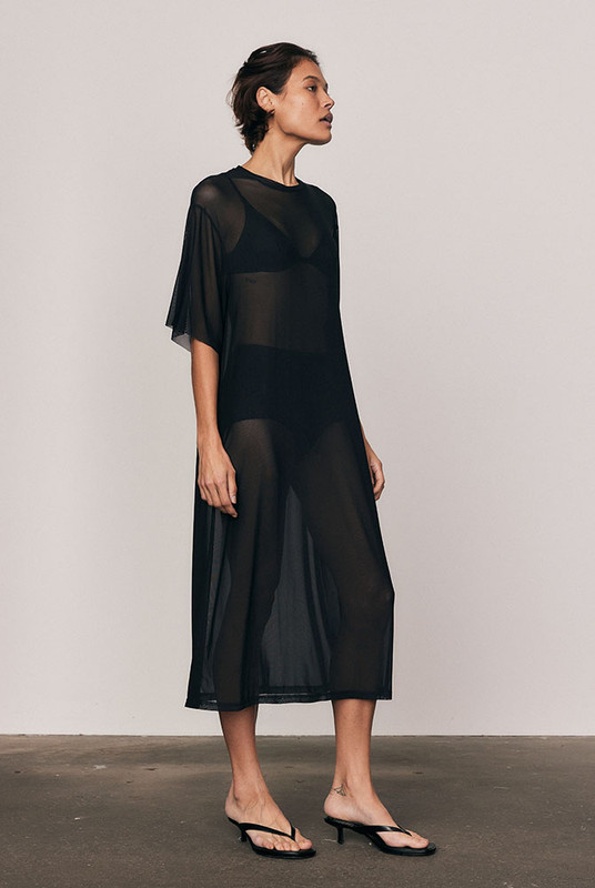 The Mesh T-Shirt Dress in soft, lightweight mesh redefines everyday ease. Cut oversized for fluid drape and comfort, it layers effortlessly over your swimwear or slip dress. Designed for convenience and modern versatility, it's a wardrobe staple that transitions seamlessly through the seasons.