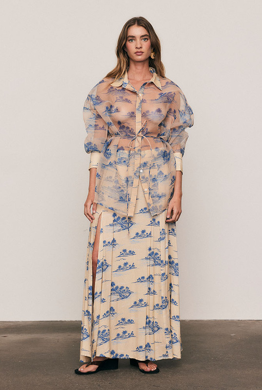 The Calm Island Maxi Skirt flows with graceful ease, cut from soft viscose in Bohemian Traders’ exclusive palm print. Designed in a flattering A-line silhouette with a subtle front split, it drapes beautifully with every step. Pair with the matching Calm Island Oversized Shirt for a modern, resort-inspired set loved by women of influence globally.