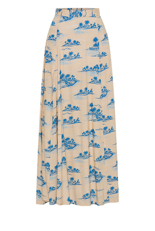 The Calm Island Maxi Skirt flows with graceful ease, cut from soft viscose in Bohemian Traders’ exclusive palm print. Designed in a flattering A-line silhouette with a subtle front split, it drapes beautifully with every step. Pair with the matching Calm Island Oversized Shirt for a modern, resort-inspired set loved by women of influence globally.