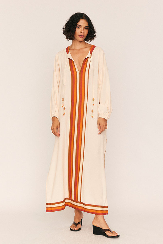 The Darcy Smock Kaftan is the kind of dreamy statement dress you'll wear on repeat—and treasure for years. Cut from soft, drapey viscose in a bold striped border print, it’s designed with intention: a loose, effortless silhouette that moves with you.