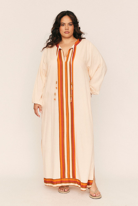 The Darcy Smock Kaftan is the kind of dreamy statement dress you'll wear on repeat—and treasure for years. Cut from soft, drapey viscose in a bold striped border print, it’s designed with intention: a loose, effortless silhouette that moves with you.