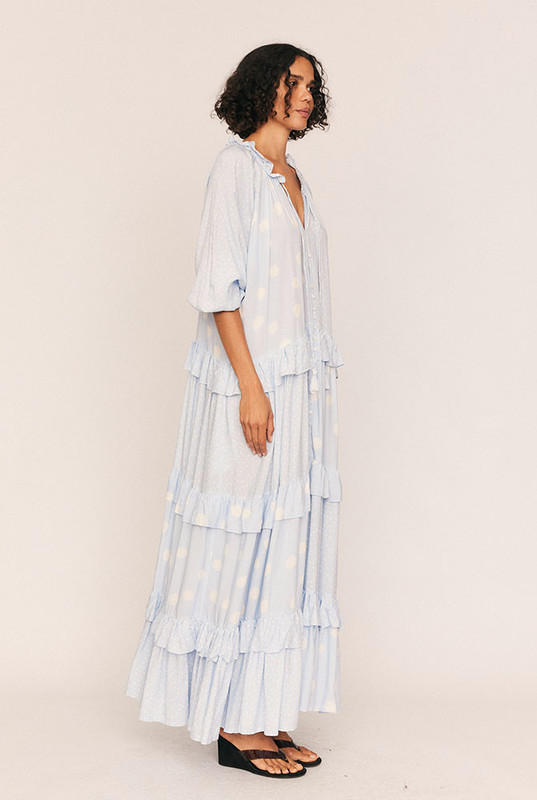 Romantic by nature and effortless by design, the Dott Ruffle Neck Maxi captures the soul of soft dressing. Crafted from smooth rayon in Bohemian Traders’ exclusive in-house print, this easy maxi dress drapes with fluid movement and gentle structure.