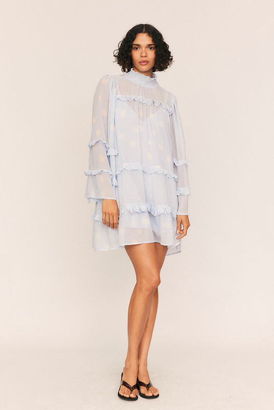 Delicate, fluid, and effortlessly romantic, the Dott Flare Sleeve Mini Dress is a sheer mini designed to make dressing feel poetic. Crafted from lightweight crepe georgette in Bohemian Traders’ custom in-house print, it floats beautifully with flared sleeves and a high neckline finished with a centre-back keyhole.