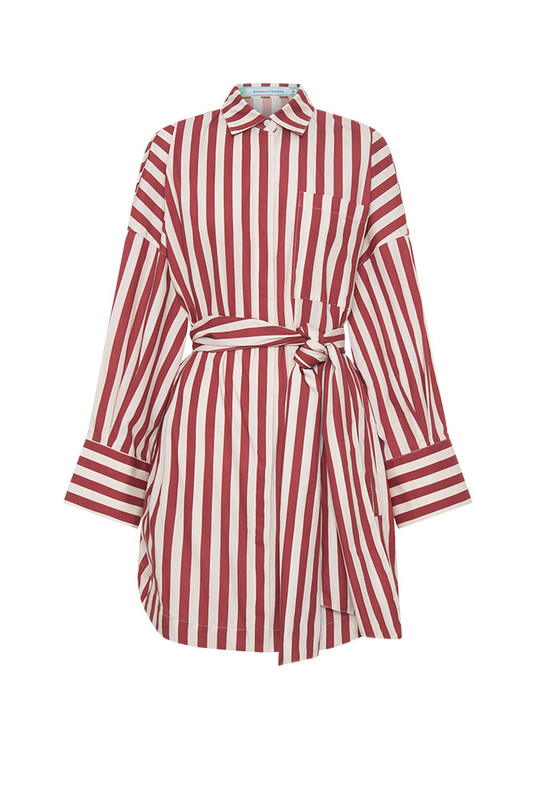 Tailored ease with a playful twist, the Tie Waist Shirt Dress blends crisp structure with easy dressing. Made from lightweight cotton poplin in bold maroon and white stripes, this mini dress offers a relaxed, oversized fit that cinches effortlessly with a fully detachable self-tie waist belt.