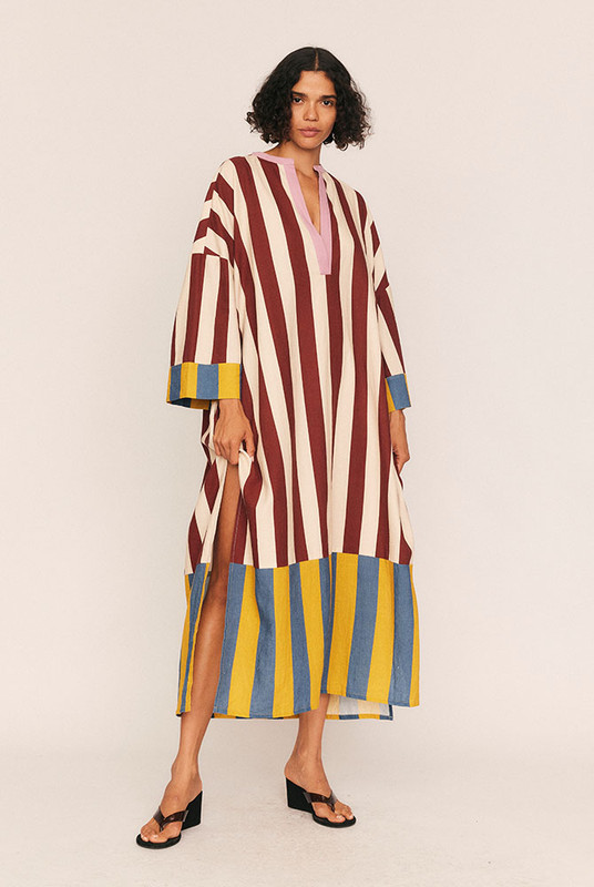 Effortlessly elegant and thoughtfully undone, the Marie Striped Kaftan Dress is a signature piece in Bohemian Traders’ Paris-inspired CAMILLE collection. Crafted from a breathable, mid-weight linen-cotton blend, this kaftan features our exclusive in-house spliced print—an artistic nod to painterly strokes.