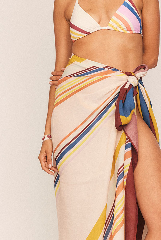 Light as air and rich in versatility, the Marie Stripe Sarong is a sun-drenched staple that belongs in every travel wardrobe. Cut from luxurious soft modal and finished in Bohemian Traders’ exclusive striped print, it drapes beautifully as a beach wrap, poolside cover-up, or even a lightweight scarf.