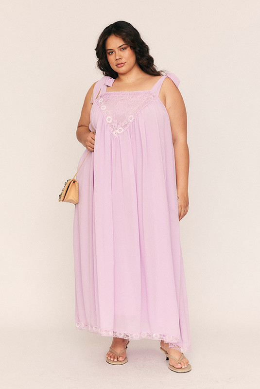 Feminine, flattering, and softly romantic, the Trim Slip Maxi is made for slow afternoons and moonlit evenings. Crafted from lightweight lilac crepe georgette and fully lined in self fabric, it drapes with a gentle swish and a touch of whimsy.