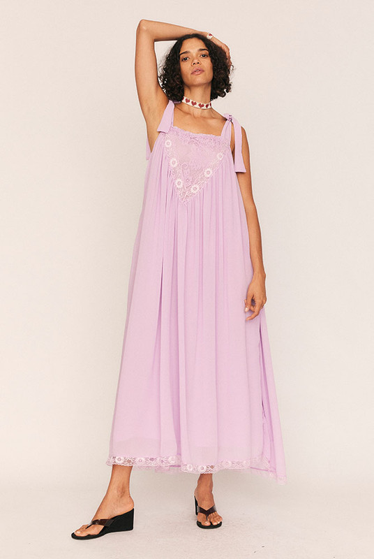 Feminine, flattering, and softly romantic, the Trim Slip Maxi is made for slow afternoons and moonlit evenings. Crafted from lightweight lilac crepe georgette and fully lined in self fabric, it drapes with a gentle swish and a touch of whimsy.