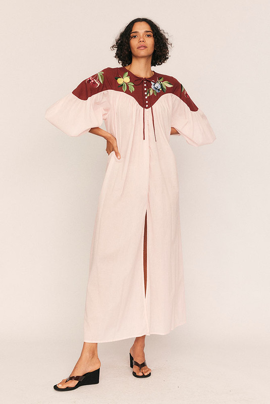 Whimsical yet grounded, the Fruito Bib Smock brings artistry to everyday wear. Crafted from soft cotton voile with a textured cotton yoke, this oversized silhouette is adorned with embroidered fruit motifs—a signature touch from Bohemian Traders’ in-house design team.