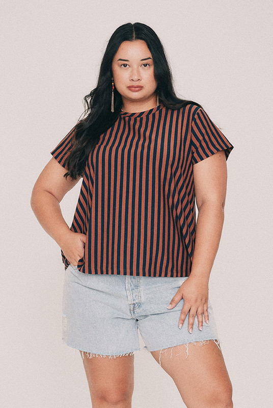 Cut from yarn dyed cotton stripe jersey, this striped tee has a relaxed swing silhouette with cap sleeves. Machine washable and quietly indispensable: wear it with the denim short all summer. Designed from a 6 to a 22.