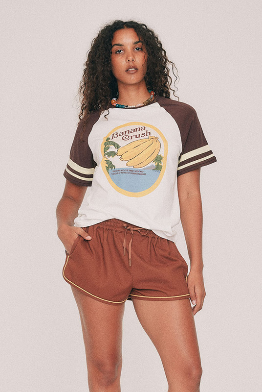 Cut from soft cotton jersey, this white tee is finished with contrast ringer binding at the neck and sleeves. The Banana Crush print was drawn by hand in our Central Coast studio. Loose, soft and machine washable, it is the piece that will be reached for the most. Designed from a 6 to a 22.