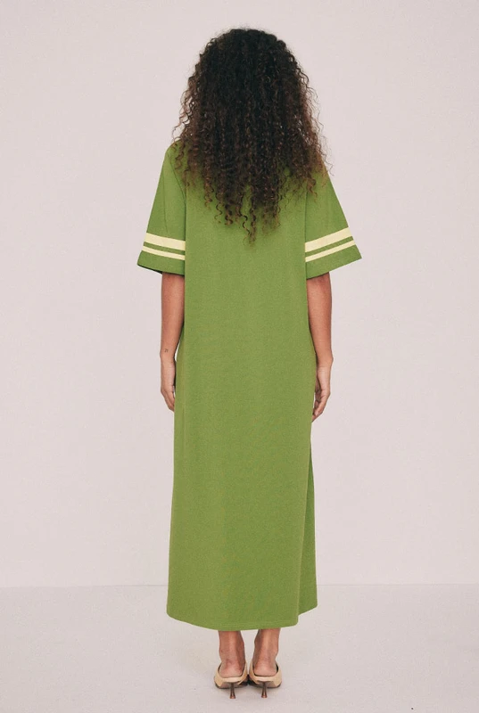 Cut from soft cotton jersey, this olive t-shirt maxi dress is the piece you'll reach for first this summer, finished with contrast ringer binding at the neck and sleeves. A side split lends movement. Machine washable and entirely undemanding: trainers now, flat sandals come January - a rainbow crochet bag all the time. Designed from a 6 to a 22.