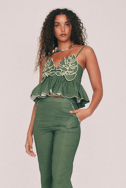 Cut from textured cotton slub, this olive crop top is finished with embroidered leaf detailing to the bust and a scalloped hem, drawn by hand in our Central Coast studio. A concealed zip sits at the centre back. For summer weddings, wear it with the Fern crop flare pant, or keep it casual with denim shorts and very little else. True to size, designed from a 6 to a 22.