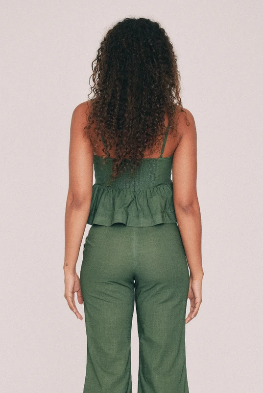 Cut from textured cotton slub, this olive crop top is finished with embroidered leaf detailing to the bust and a scalloped hem, drawn by hand in our Central Coast studio. A concealed zip sits at the centre back. For summer weddings, wear it with the Fern crop flare pant, or keep it casual with denim shorts and very little else. True to size, designed from a 6 to a 22.