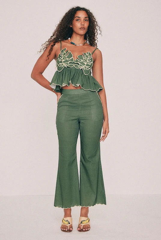 Cut from textured cotton slub, these olive cropped flare pants are finished with a scalloped embroidered hem. Mid-rise and fitted at the waist, with a concealed back zip and pockets set into the side seams. Good with a flat, better with a heel and the matching top. Designed from a 6 to a 22.