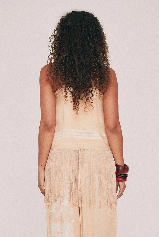 Cut from viscose satin with the weight and fall of silk, this cream slip top is finished with a fringed hem that moves when you do. The Kai design is placement printed from an illustration drawn in our Central Coast studio. Adjustable straps allow the fit to be set exactly as you wish. Wear it to dinner with the matching satin pant and gold at the ear. Designed from a 6 to a 22.