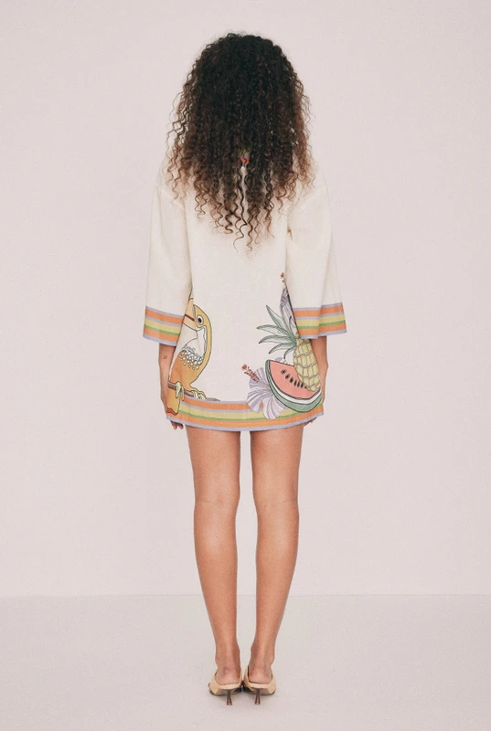 Cut from textured cotton slub, this cream kaftan mini dress is oversized and placement printed with the Tropicana design. A low V neck and three-quarter sleeves cut wide lend it drift, while pockets sit in the side seams. Throw it on over swimmers, or wear to dinner with the twisted bead choker and playful heels. Designed from a 6 to a 22.