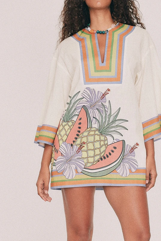 Cut from textured cotton slub, this cream kaftan mini dress is oversized and placement printed with the Tropicana design. A low V neck and three-quarter sleeves cut wide lend it drift, while pockets sit in the side seams. Throw it on over swimmers, or wear to dinner with the twisted bead choker and playful heels. Designed from a 6 to a 22.