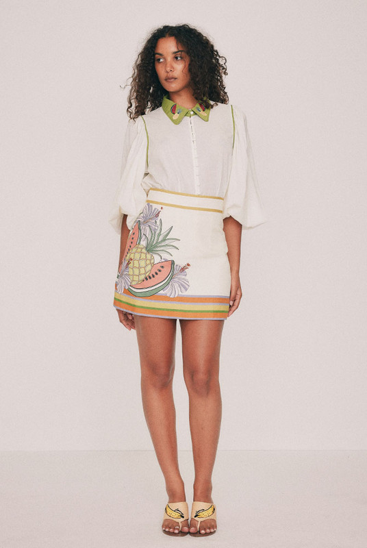 Cut from textured cotton slub, this cream mini skirt is placement printed with the Tropicana design drawn in our Central Coast studio. A high fixed waistband and concealed centre back zip keep the line clean. Short and quiet enough to carry the matching blouse, or a plain white tee. Designed from a 6 to a 22.
