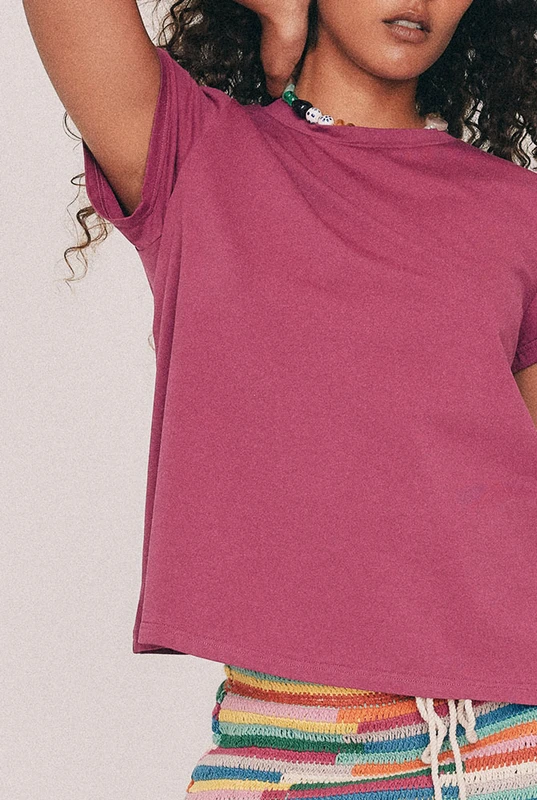 This Magenta tee has a relaxed swing silhouette with cap sleeves. Machine washable and quietly indispensable: wear it with the crochet skirt all summer. Designed from a 6 to a 22.