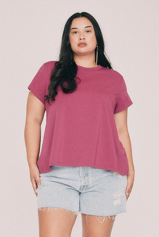This Magenta tee has a relaxed swing silhouette with cap sleeves. Machine washable and quietly indispensable: wear it with the crochet skirt all summer. Designed from a 6 to a 22.