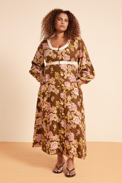 Crafted from a soft linen-cotton blend and printed with a custom in-house designed floral in rich chocolate tones, the Juliet Scoop Neck Midi Dress features a flattering scoop neckline, elasticated waist, and statement balloon sleeves, it’s softly structured yet easy to wear. Style with strappy sandals and gold accents for long lunches or late summer evenings.