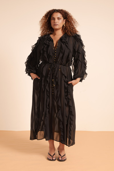 Meet your new favourite maxi dress - soft crepe georgette in deep black, flowing gently with every step. The Sunray Flounce features a low V neckline with delicate ties and billowing sleeves gathered at the wrist for a subtle drama. Lightweight and semi-sheer, it carries the ease of a Mediterranean breeze with side pockets for a modern touch.