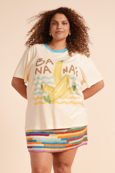 The Bananas Tee in creamy cotton jersey is an easy, oversized essential that blends everyday comfort with playful charm. Printed with a whimsical in-house design, its relaxed crew neck and short sleeves make it the perfect laid-back layer for sun-drenched mornings and slow afternoons. Soft, lightweight, and effortlessly cool - pair it with the Crochet Knit Mini for fun statement style.