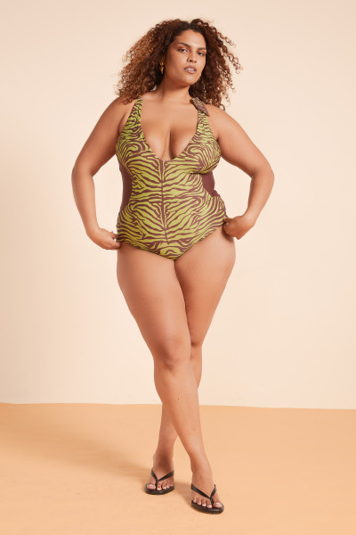 Bold, flattering, and comfortable, this boy-leg swimsuit features plunging front and back V necklines, tie shoulder straps, and supportive lining in a signature zebra print. Belted at the waist, it is fully lined and designed to move with you.
