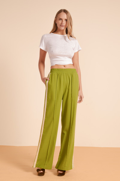 Our signature Track Pants are back with a seasonal refresh. They are our comfortable, relaxed take on sharp tailoring. Made from blended linen, they have an elasticated mid-rise waistband featuring a stripe to the sides for a relaxed feel. Wear yours with a tucked-in tank or collared shirt from the collection.