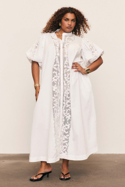 This romantic dress is inspired by the effortless style of the Australian coast. It's cut from crisp cotton-poplin with delicate appliqued flowers and vines to the front. Temper the blousen sleeves by cinching the waist.