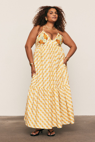 A best-selling silhouette reimagined in sunset hues, the Gingham Slip Dress is crafted from mid-weight cotton with embroidered appliqué detailing. Featuring a fitted bodice, full skirt and gathered back, it flatters with ease and movement. Made from natural fibre for breathable comfort, it’s timeless, feminine, and destined to sell out fast.