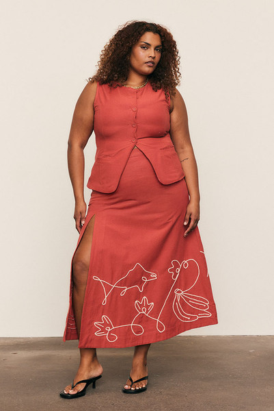 The Circle Skirt celebrates craftsmanship and movement. Cut from a cotton–linen blend, it’s embroidered with Bohemian Traders’ custom rope detailing for subtle texture and artistry. Its full, sweeping shape and side split lend drama to festive occasions — a natural-fibre piece designed to glide effortlessly from long lunches to moonlit celebrations.