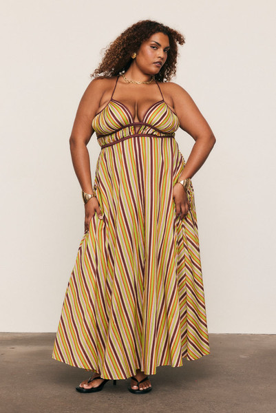 Softly structured and effortlessly refined, the Maggie Stripe Slip Dress is cut from lightweight cotton voile in Bohemian Traders’ custom spliced stripe print. Designed to flatter the body with a gathered underbust, low V-neck and adjustable cross-back straps, it drapes fluidly through the skirt, delivering timeless summer elegance with modern ease.