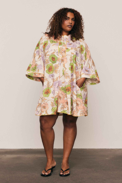 This linen-cotton blend mini dress is defined by its artful, in-house floral print and relaxed tailoring. Designed for a comfortable, breezy fit, its mandarin collar, wide half-length sleeves, and crisp A-line silhouette offer sophisticated simplicity. Piping detail and functional side pockets ensure an elevated utility, making this an effortlessly modern piece for your summer capsule wardrobe.