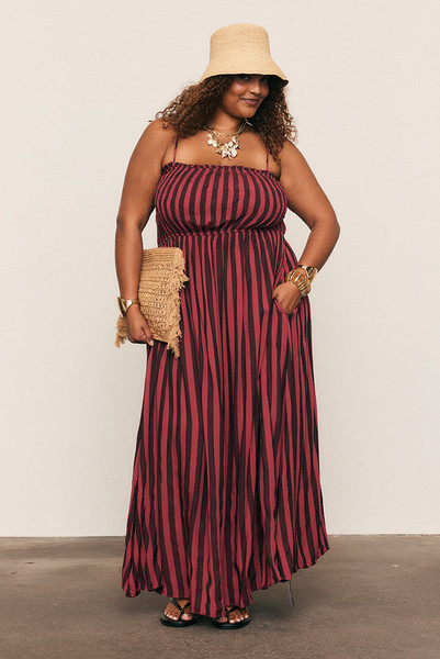 Soft and fluid, the Ruched Slip Maxi Dress is crafted from draped viscose rayon in Bohemian Traders’ custom magenta stripe print. A ruched bodice flatters the form before flowing into an A-line skirt that moves with ease. Effortless femininity meets artful design - a timeless piece for long lunches, warm evenings, and summer celebration.