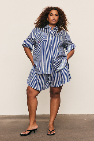 Relaxed and refined, the Stripe Wide Leg Short is crafted from a soft Rayon–Tencel shirting blend in a crisp stripe. Designed with an elasticated waist and fluid wide-leg silhouette, it moves beautifully for effortless summer ease. Pair with the matching Stripe Classic Shirt for a modern, co-ordinated take on everyday dressing.