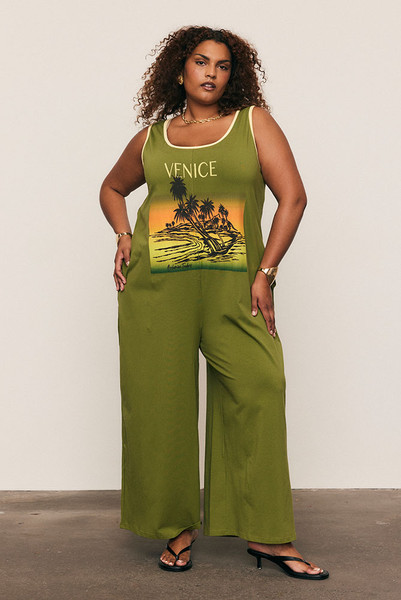 The Relaxed Jersey Jumpsuit is your one-and-done outfit for days that call for comfort and confidence. Cut from soft cotton-blend jersey in Jungle Green, it features a custom chest print, cropped wide leg and easy, relaxed fit. Slip it on and go. It’s simple, flattering and made for life in motion.