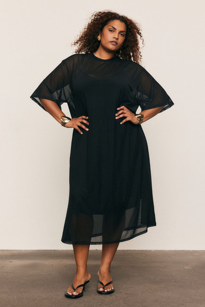 The Mesh T-Shirt Dress in soft, lightweight mesh redefines everyday ease. Cut oversized for fluid drape and comfort, it layers effortlessly over your swimwear or slip dress. Designed for convenience and modern versatility, it's a wardrobe staple that transitions seamlessly through the seasons.