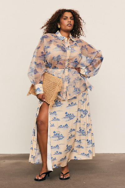 The Calm Island Maxi Skirt flows with graceful ease, cut from soft viscose in Bohemian Traders’ exclusive palm print. Designed in a flattering A-line silhouette with a subtle front split, it drapes beautifully with every step. Pair with the matching Calm Island Oversized Shirt for a modern, resort-inspired set loved by women of influence globally.