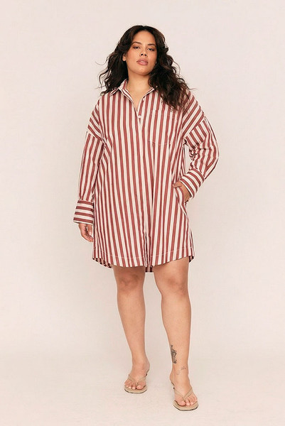 Tailored ease with a playful twist, the Tie Waist Shirt Dress blends crisp structure with easy dressing. Made from lightweight cotton poplin in bold maroon and white stripes, this mini dress offers a relaxed, oversized fit that cinches effortlessly with a fully detachable self-tie waist belt.