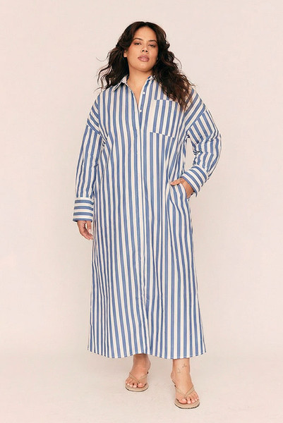 Easy, airy, and effortlessly elegant, the Tie Waist Maxi Dress is a modern classic with endless styling potential. Crafted from crisp, cotton poplin in bold blue and white stripes, it’s designed to fit with intention—oversized through the body, but cinched at the waist with a removable self-tie for personalised shape.