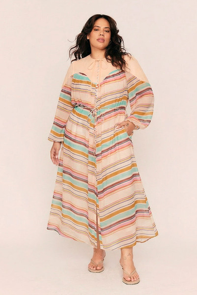 A whisper of nostalgia woven through modern lines, the Marie Sheer Smock Maxi is a poetic ode to sun-drenched Parisian afternoons and quiet femininity. Cut from lightweight crepe georgette with a custom pastel stripe print, this semi-sheer silhouette floats effortlessly with every step. A soft linen yoke and round neckline lend structure, while an elasticated cuff and rouleau waist tie invite softness and shape.