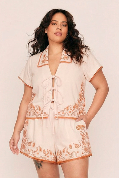 Sweet yet spirited, the Bonnie Embroidered Top is a cropped cotton poplin blouse brought to life with bold, artisanal embroidery. Set against a dreamy pastel pink base, vibrant orange threadwork creates a striking contrast—evoking a sense of playful femininity with a handcrafted feel.