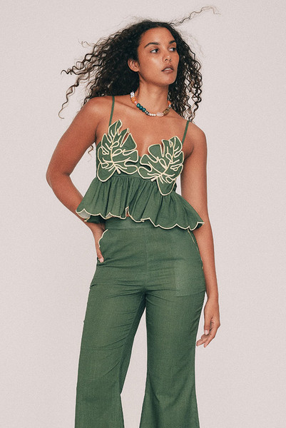Cut from textured cotton slub, this olive crop top is finished with embroidered leaf detailing to the bust and a scalloped hem, drawn by hand in our Central Coast studio. A concealed zip sits at the centre back. For summer weddings, wear it with the Fern crop flare pant, or keep it casual with denim shorts and very little else. True to size, designed from a 6 to a 22.