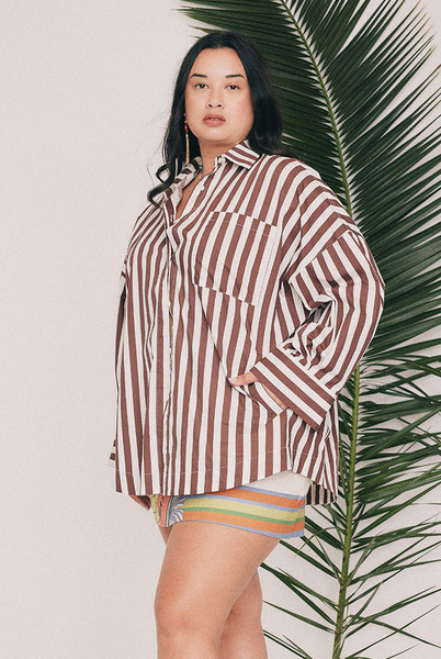 Cut from crisp cotton poplin, this oversized striped shirt is finished with a classic collar, long cuffed sleeves and a patch pocket at the chest and practical pockets to the sides. Wear it buttoned and tucked through the week, or open over everything on a Saturday. Intended to be oversized, so size down for a closer fit. Designed from a 6 to a 22.