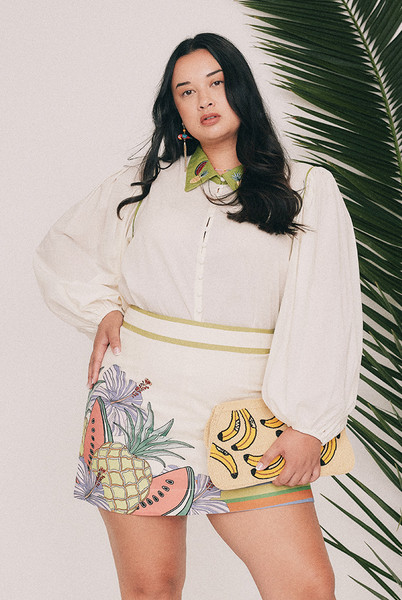 Cut from soft cotton voile, this cream blouse is finished with an embroidered collar designed in our Central Coast studio. Long puff sleeves gather at an elasticated cuff and the front buttons the whole way down. Tuck it into the Tropicana mini skirt, or wear it loose over denim shorts for a more casual approach. True to size, designed from a 6 to a 22.