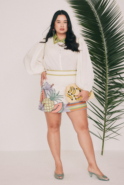 Cut from textured cotton slub, this cream mini skirt is placement printed with the Tropicana design drawn in our Central Coast studio. A high fixed waistband and concealed centre back zip keep the line clean. Short and quiet enough to carry the matching blouse, or a plain white tee. Designed from a 6 to a 22.